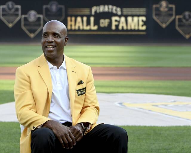 Barry Bonds smiles as he is introduced as a Pirates Hall of Famer during a pregame ceremony before a game against the Reds on Saturday, Aug. 24, 2024, at PNC Park.