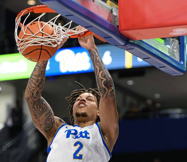 Pitt forward Cam Corhen dunks against Youngstown State on Monday at Petersen Events Center.