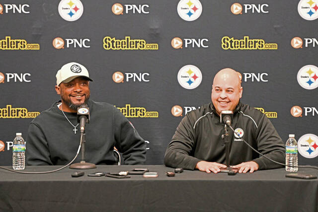 Steelers general manager Omar Khan (right) and coach Mike Tomlin speak at a press conference at the UPMC Rooney Sports Complex before the 2023 NFL Draft.