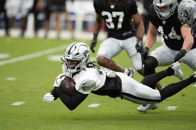 Las Vegas Raiders wide receiver Jakobi Meyers (16) catches a ball at training camp on Aug. 2, 2025, in Las Vegas.