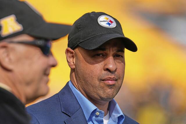 Pittsburgh Steelers general manager Omar Khan, right, and owner Art Rooney II, left, watch warmups before an NFL football game against the Indianapolis Colts on Sunday.