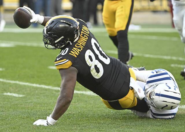 Pittsburgh Steelers tight end Darnell Washington stretches the ball for a first down during this past Sunday’s game against the Indianapolis Colts. Washington on Wednesday missed the first practice of the week because of a foot injury.