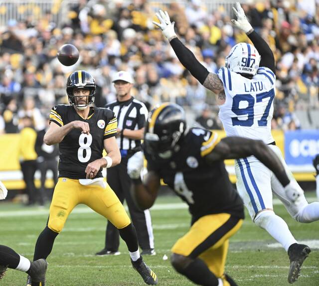 Steelers quarterback Aaron Rodgers makes a quick throw with the Colts’ Lantau Latu bearing down on him in the fourth quarter Sunday, Nov. 2, 2025, at Acrisure Stadium.