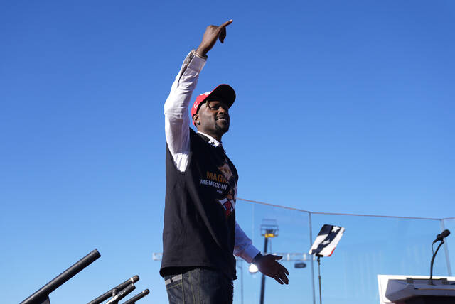 Former Pittsburgh Steelers Antonio Brown, gestures before Republican presidential nominee former President Donald Trump speaks during a campaign rally at Arnold Palmer Regional Airport.