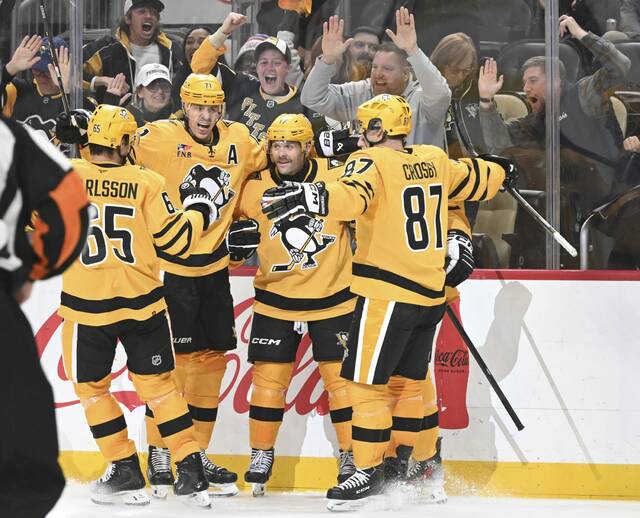 The Penguins celebrate Bryan Rust’s game-winning goal against the Capitals in the third period Thursday, Nov. 6, 2025 at PPG Paints Arena.