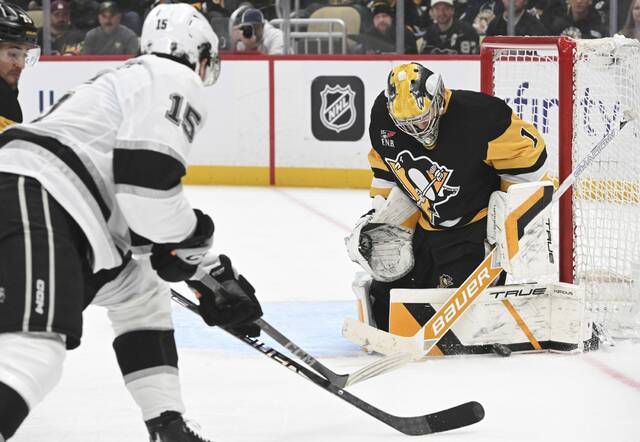 Penguins goaltender Sergei Murashov makes a save on the Kings’ Alex Turcotte in the second period Sunday.