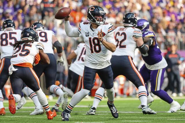 Chicago Bears quarterback Caleb Williams (18) passes during the first half of an NFL football game against the Minnesota Vikings, Sunday, Nov. 16, 2025, in Minneapolis.