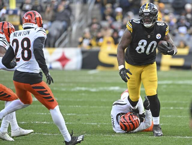 Pittsburgh Steelers tight end Darnell Washington breaks a tackle during this past Sunday’s game against the Cincinnati Bengals at Acrisure Stadium.