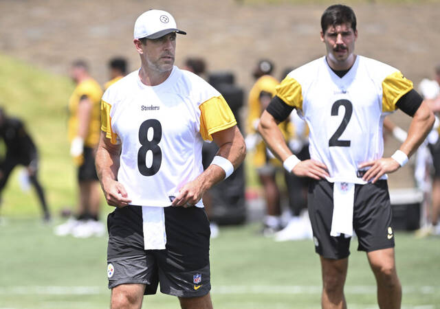 Steelers quarterback Aaron Rodgers and Mason Rudolph during practice July 24 at Saint Vincent College.