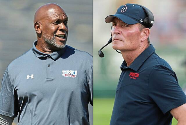 Robert Morris football coach Bernard Clark Jr. (left) and Duquesne football coach Jerry Schmitt