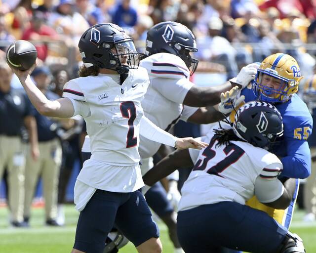 Duquesne quarterback Tyler Riddell, shown earlier this season against Pitt, helped the Dukes to victory Saturday.