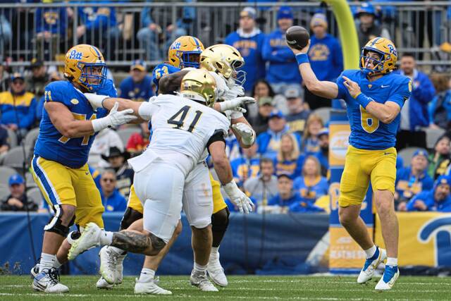 Pitt quarterback Mason Heintschel (6) throws a pass amidst pressure from the Notre Dame defense on Saturday, Nov. 15, 2025, at Acrisure Stadium.