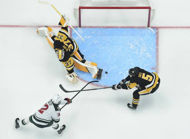 Minnesota Wild forward Matt Boldy beats Penguins goaltender Arturs Silovs and defenseman Ryan Shea for a goal during during a game at PPG Paints Arena on Friday. The Wild won, 5-0.