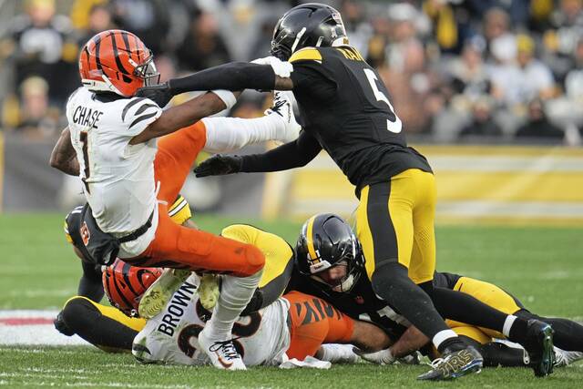 Cincinnati Bengals wide receiver Ja’Marr Chase is tackled by Pittsburgh Steelers cornerback Jalen Ramsey during a play that he allegedly spit on Ramsey, during an NFL football game in Pittsburgh Sunday, Nov. 16, 2025.
