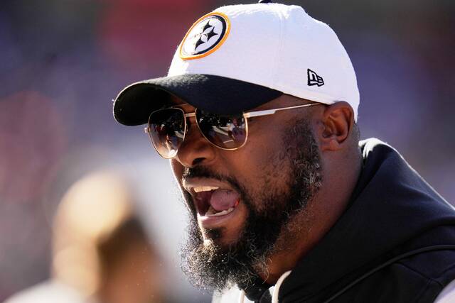 Pittsburgh Steelers head coach Mike Tomlin give instructions on the sideline during the first half of an NFL football game against the Chicago Bears, Sunday, Nov. 23, 2025, in Chicago.