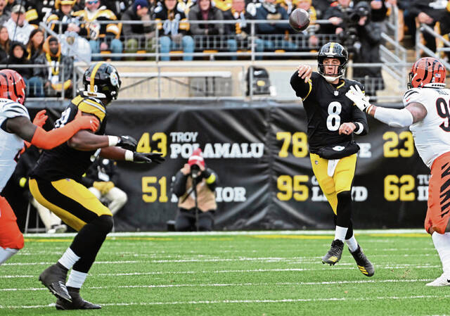 Pittsburgh Steelers quarterback Aaron Rodgers attempts a short pass to tight end Darnell Washington during the Nov. 16 game against the Cincinnati Bengals Sunday at Acrisure Stadium. Rodgers on average is throwing more short passes than any other quarterback in the league.