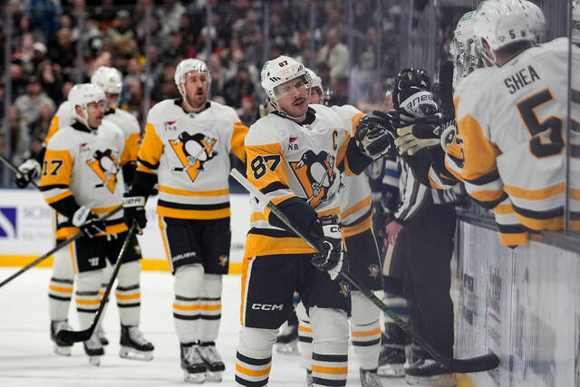 Penguins center Sidney Crosby (87) skates past the bench after scoring during the first period against the Blue Jackets on Friday in Columbus.