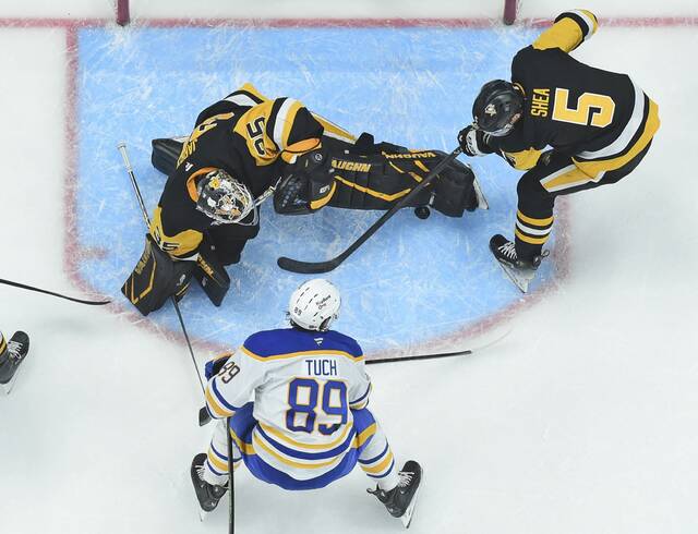 Penguins goaltender Tristan Jarry makes a late third-period save on the Sabres’ Alex Tuch on Wednesday at PPG Paints Arena.