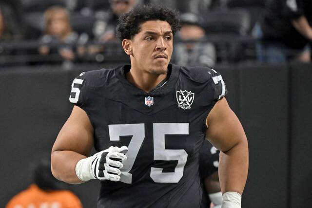 Shown in this photo looking on during a game for the Las Vegas Raiders last season, veteran offensive lineman Andrus Peat will make his first start as a member of the Pittsburgh Steelers on Sunday against the Buffalo Bills.