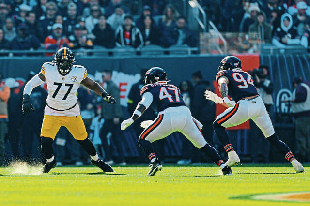 Pittsburgh Steelers offensive tackle Broderick Jones (77) blocks against Chicago Bears linebacker Ruben Hyppolite II (47) during the first half of an NFL football game, Sunday, Nov. 23, 2025, in Chicago. 
                                Pittsburgh Steelers offensive tackle Broderick Jones (77) blocks against Chicago Bears linebacker Ruben Hyppolite II (47) during the first half of an NFL football game, Sunday, Nov. 23, 2025, in Chicago.