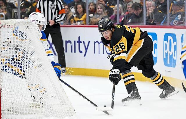 Pittsburgh Penguins forward Tristan Broz battles in his NHL debut against the Buffalo Sabres on Nov. 26, 2025, at PPG Paints Arena.