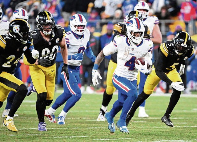 Bills running back James Cook III breaks into clean grass against the Steelers defense in the third quarter Sunday Nov. 30, 2025 at Acrisure Stadium.