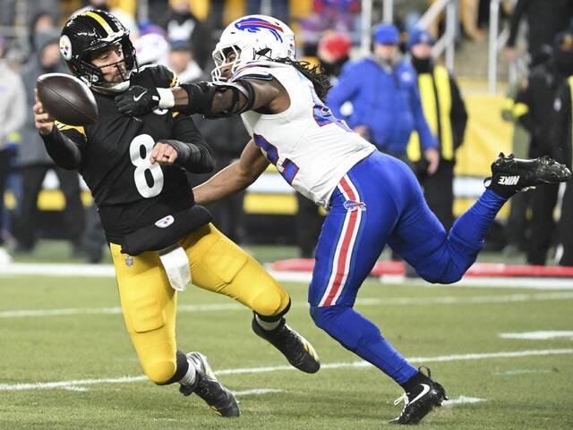 Pittsburgh Steelers quarterback Aaron Rodgers is pressured by the Buffalo Bills’ Dorian Williams in the second quarter of Sunday’s game at Acrisure Stadium. Rodgers returned from a one-game absence because of a wrist fracture but then suffered a bloodied nose Sunday.