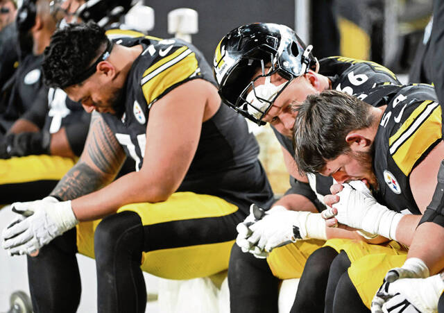 Steelers offensive lineman Zach Frazier, Mason McCormick and Troy Fautanu on the bench as the Bills beat the Steelers Sunday at Acrisure Stadium.
