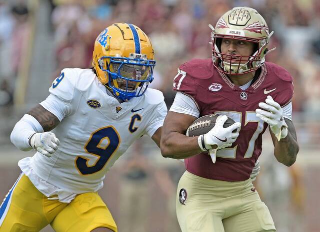 Florida State running back Gavin Sawchuk (27) runs the ball past Pitt linebacker Kyle Louis (9) during the first half Oct. 11, 2025, at Doak S. Campbell Stadium.