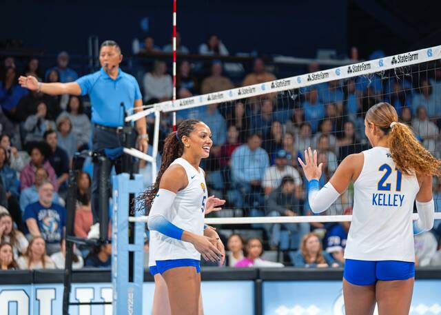 Olivia Babcock (5) and Bre Kelley (21) talk during a match against North Carolina this season. (Pitt Athletics)