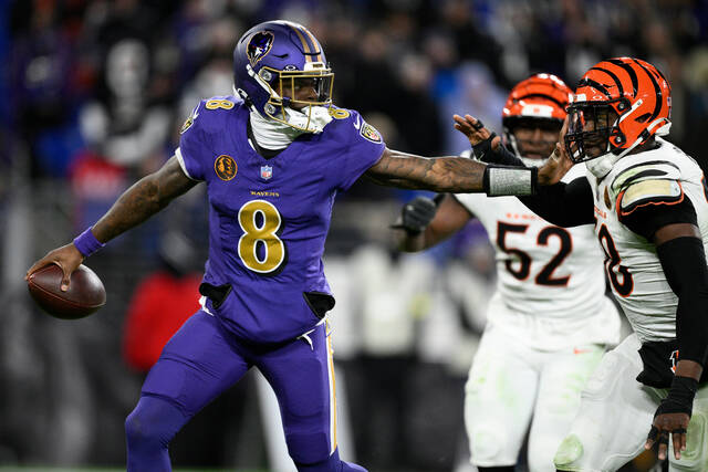 Baltimore Ravens quarterback Lamar Jackson is pressured by Cincinnati Bengals defensive end Joseph Ossai during last week’s game in Baltimore. (AP)