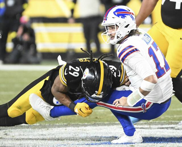 Shown hitting Buffalo Bills quarterback Josh Allen during Sunday’s game at Acrisure Stadium, Pittsburgh Steelers safety Kyle Dugger was added to the injury report Wednesday. (Chaz Palla | TribLive)
