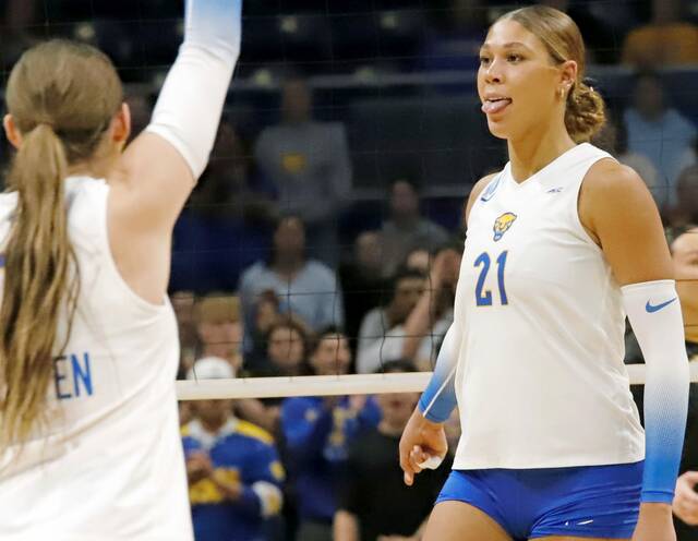 Pitt senior middle blocker Bre Kelley celebrates blocking a shot Friday night during the first round of the NCAA women’s volleyball tournament at Petersen Events Center. (Josh Rizzo | For TribLive)