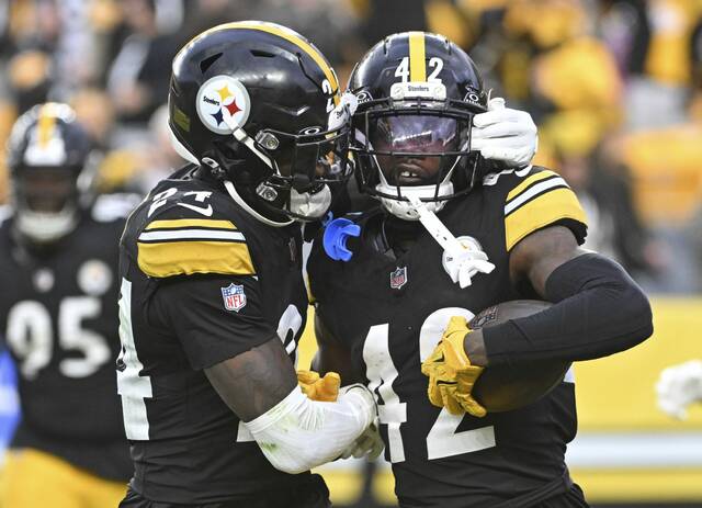 Pittsburgh Steelers cornerbacks Joey Porter Jr. and James Pierre celebrate during a game last month at Acrisure Stadium. Each on Friday was cleared to play in Sunday’s game at the Baltimore Ravens. (Chaz Palla | TribLive)