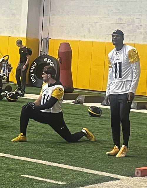Pittsburgh Steelers wide receivers Adam Thielen (No. 16, left) and Marquez Valdes-Scantling (No. 11) stretch during Thursday’s practice at the UPMC Rooney Sports Complex. (Joe Rutter | TribLive)