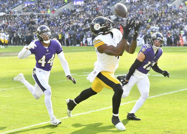 Steelers receiver DK Metcalf beats the Ravens’ Marlon Humphrey and Alohi Gilman in the first quarter Sunday. (Chaz Palla | TribLive)