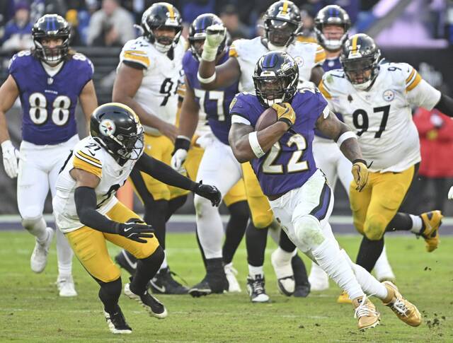 Pittsburgh Steelers safety Chuck Clark tracks down Baltimore Ravens running back Derrick Henry during the fourth quarter of Sunday’s game at M&T Bank Stadium. Clark was one of several Steelers players to leave the game for some period of time because of injury. (Chaz Palla | TribLive)