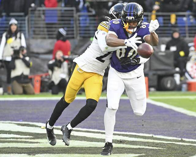 Steelers cornerback Joey Porter Jr. knocks the ball from the Ravens’ Isaiah Likely in the end zone in the fourth quarter Sunday, Dec. 07, 2025 at M&T Bank Stadium. (Chaz Palla | TribLive)