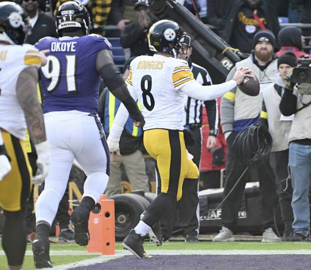 Steelers quarterback Aaron Rodgers pushes the ball across the goal line against the Ravens in the first quarter Sunday, Dec. 7, 2025 at M&T Bank Stadium. (Chaz Palla | TribLive)