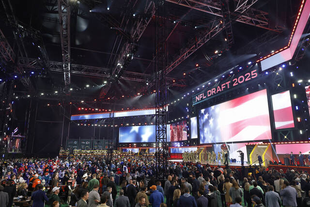 An overall general view of the draft theater with fans during the first round of the NFL football draftin Green Bay, Wis. (AP)