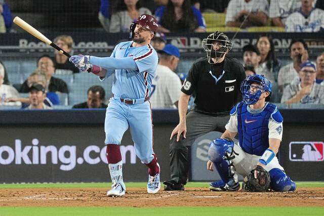 The Phillies’ Kyle Schwarber follows his solo home run off Los Angeles Dodgers starting pitcher Yoshinobu Yamamoto during the fourth inning in Game 3 of the NLDS on Oct. 8. (AP)