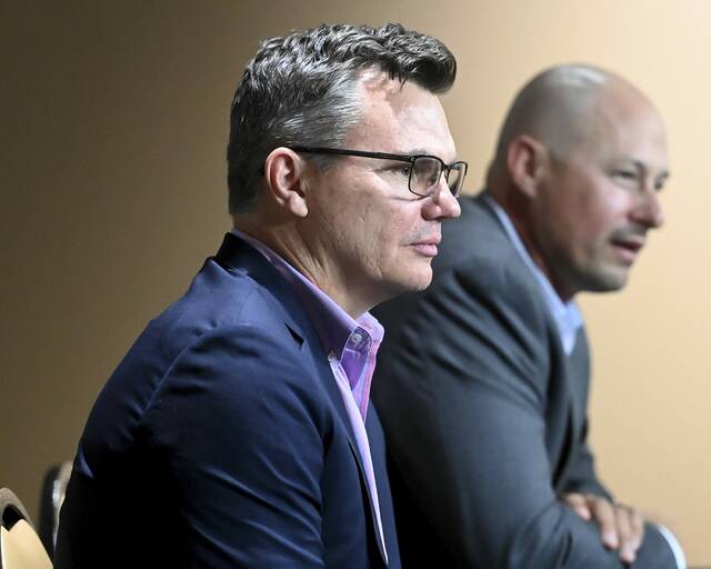 Pirates general manager Ben Cherington listens as manager Don Kelly takes questions during a press conference to announce Kelly’s contract extension on Monday, Sept. 29, 2025, at PNC Park. (Christopher Horner | TribLive)