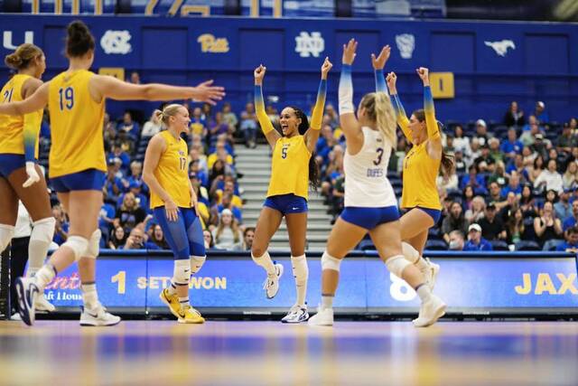 Pitt’s Olivia Babcock (center) had 41 kills, a program record, in the Panthers’ five-set win over Louisville earlier this season. (Courtesy of Pitt Athletics)