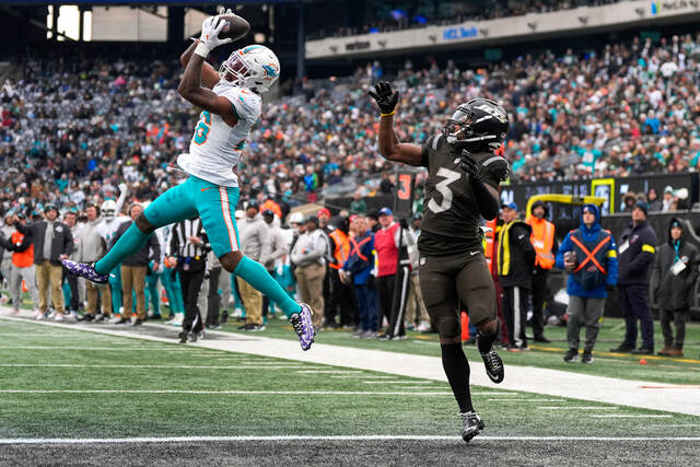 Miami Dolphins cornerback Rasul Douglas intercepts a pass intended for New York Jets wide receiver John Metchie III during a game earlier this month in East Rutherford, N.J. (AP)