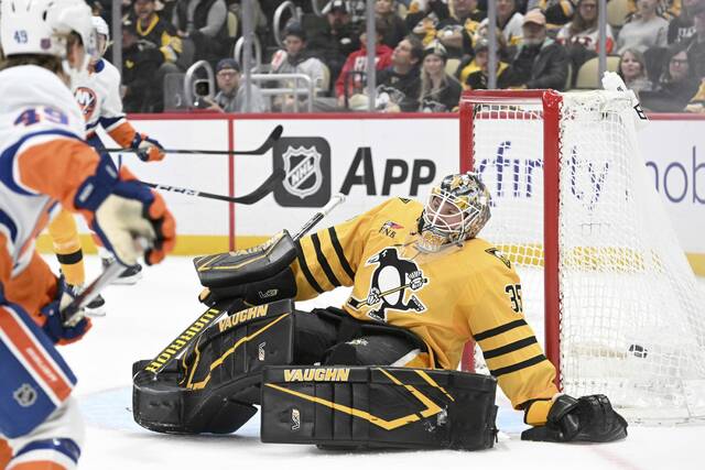 The Islanders’ Max Shabanov’s shot beats Penguins goaltender Tristan Jarry late in the second period Oct. 9, 2025, at PPG Paints Arena. (Chaz Palla | TribLive)