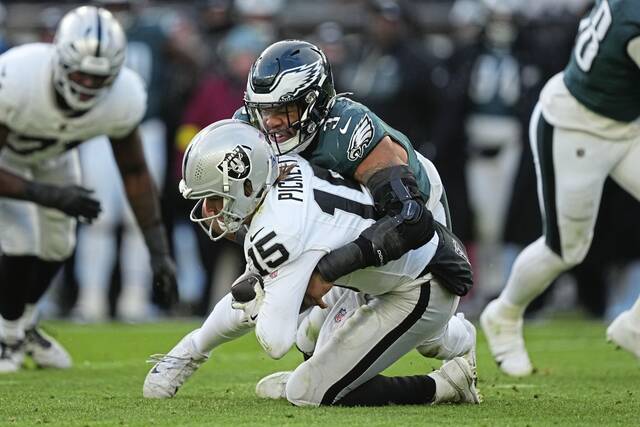 Eagles linebacker Nolan Smith sacks Las Vegas Raiders quarterback Kenny Pickett on Sunday in Philadelphia. (AP)