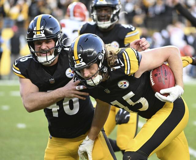 Pittsburgh Steelers special-teamer Ben Skowronek (right, No. 16) celebrates with teammate and long snapper Christian Kuntz during a game last season at Acrisure Stadium. Skowronek is the only Steelers player among the top four at a listed position in fan voting for the Pro Bowl. (Chaz Palla | TribLive)