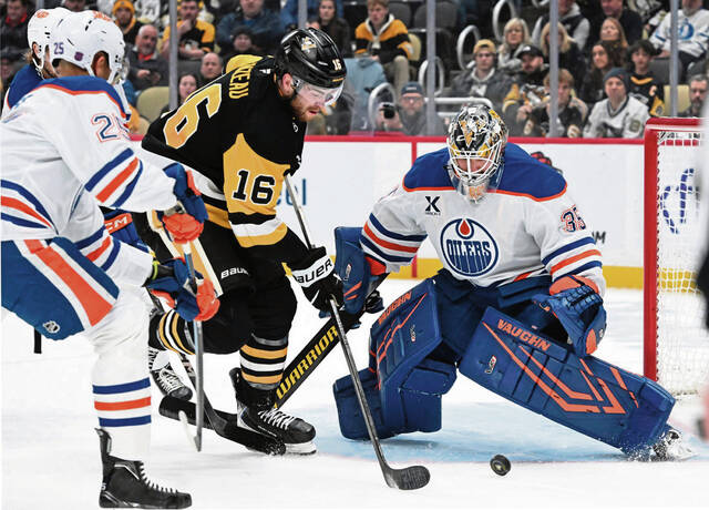 Oilers goaltender Tristan Jarry makes a save on the Penguins’ Justin Brazeau in the first period Tuesday at PPG Paints Arena. (Chaz Palla | TribLive)