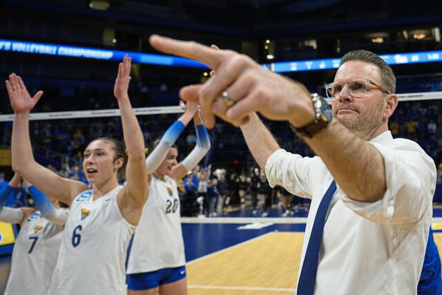 Pitt coach Dan Fisher points to the crowd as he celebrates a victory over Purdue on Saturday at Petersen Events Center. (Andrew Palla | For TribLive)