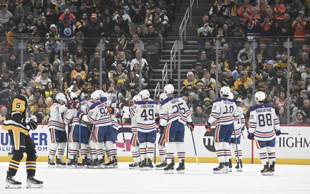 The Oilers bench clears Tuesday after Leon Draisaitl got his 1,000th career point in the first period against the Penguins at PPG Paints Arena. (Chaz Palla | TribLive)
